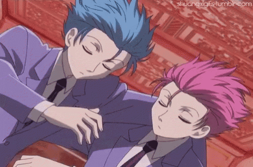 two anime characters with blue hair and pink hair sleeping together