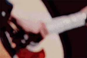a close up of a person 's mouth with a knife sticking out of it