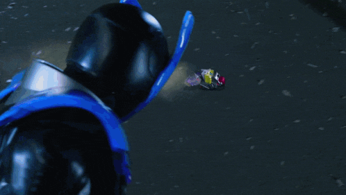 a person 's feet are visible in a blurry photo against a dark background