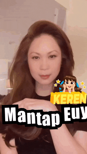 a woman with a yellow sign that says mantap euy