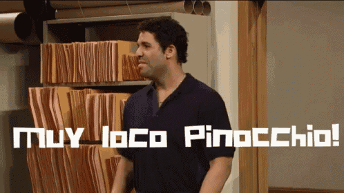 a man stands in front of a filing cabinet with the words muy loco pinocchio