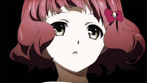 a close up of a girl with red hair and a bow in her hair