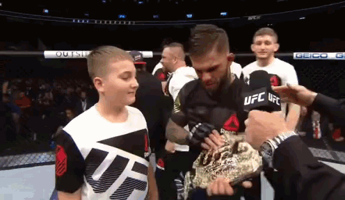 a man in a ufc shirt is being interviewed
