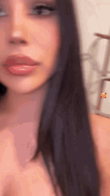 a close up of a woman 's face with red lips