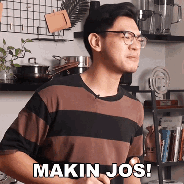 a man wearing glasses and a striped shirt is saying makin jos