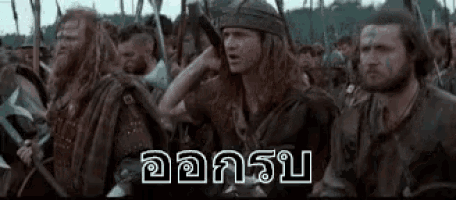 a group of men are standing next to each other in a field with swords .