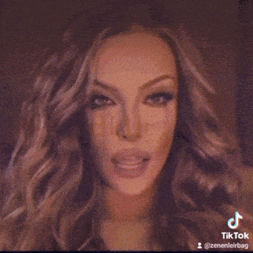 a close up of a woman 's face with a tiktok watermark on it