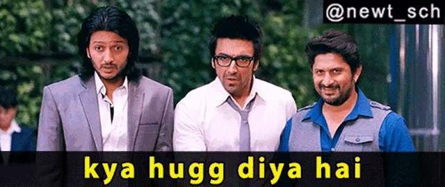 three men are standing next to each other with the caption " kya hugg diya hai "