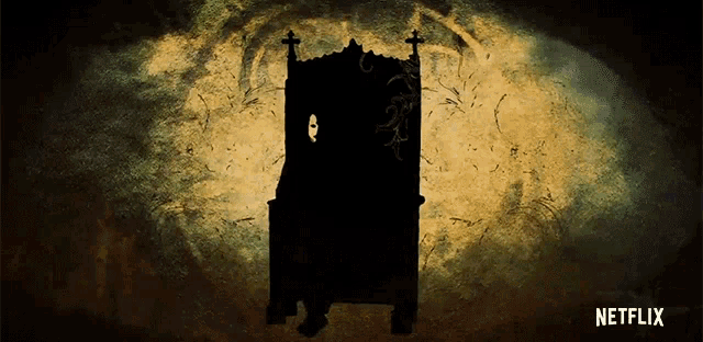 a silhouette of a person sitting in a chair with a netflix logo in the background