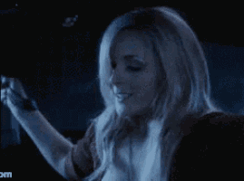 a woman with long white hair is looking up at the sky