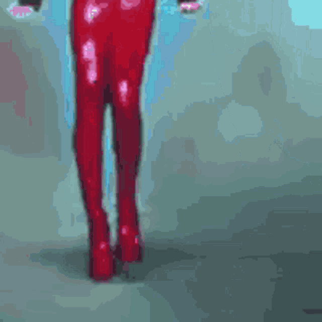 a pixel art of a woman in red pants