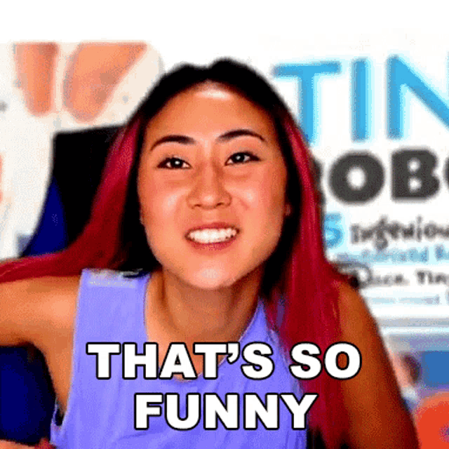 a woman with red hair is smiling with the words that 's so funny on her face .