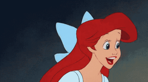 the little mermaid ariel is smiling with her eyes closed