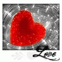 a red heart is sitting on top of a glass .