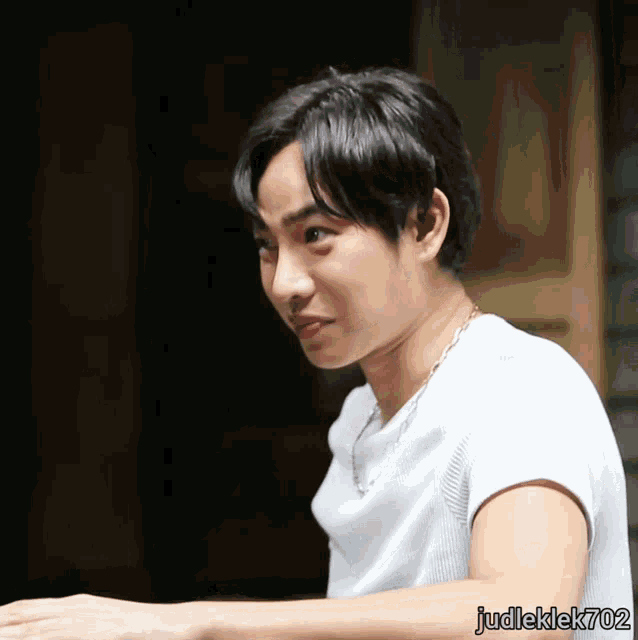 a man in a white shirt with judleklek702 on the bottom