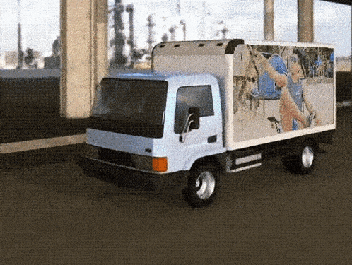 a white truck with a picture of a man riding a bike on the side of it