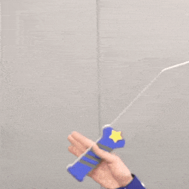 a person is holding a blue object with a star on it .
