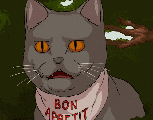 a cat wearing a bib that says bon appetit on it