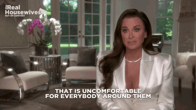 a woman says that is uncomfortable for everybody around them in a living room
