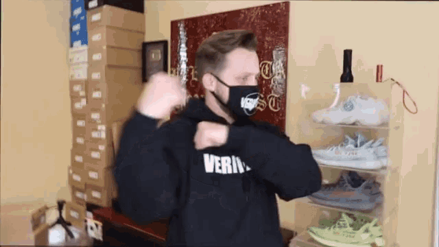 a man wearing a black hoodie with the word verite on the front