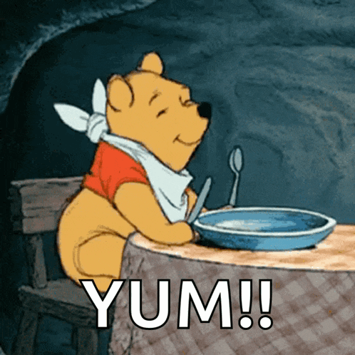 a cartoon of winnie the pooh sitting at a table with a plate of food and the words yum written below him