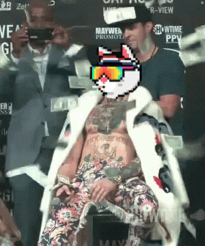 a man in a fur coat has a pixel cat on his head