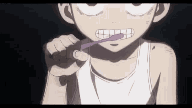 a close up of a person brushing their teeth with a purple toothbrush .