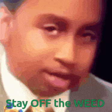 a man in a suit and tie with the words stay off the weed below him