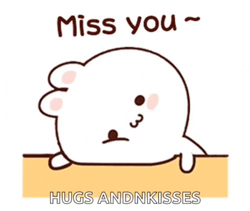 a cartoon seal with the words `` miss you hugs and kisses '' written on it