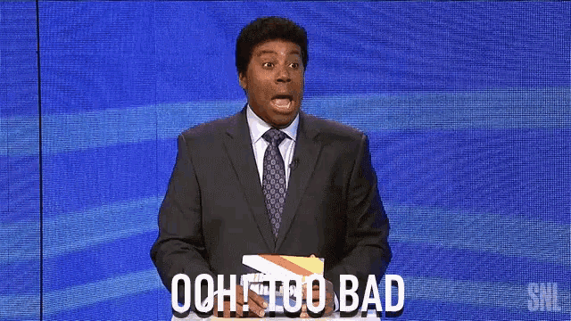 a man in a suit and tie stands in front of a blue screen that says ooh too bad