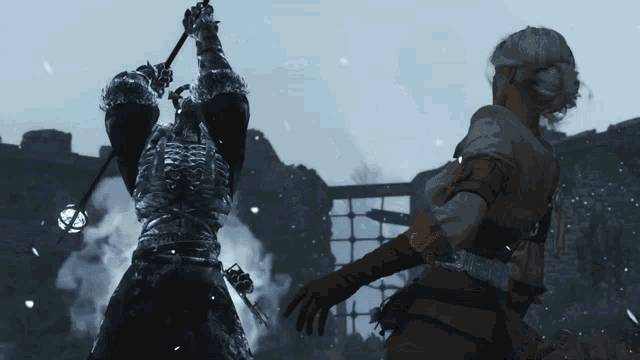 a woman is standing next to a man in armor