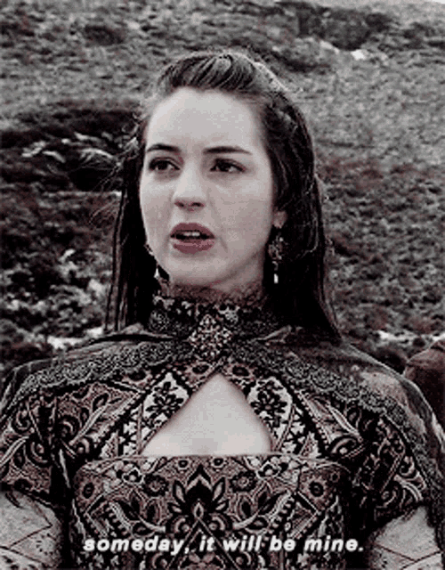 a woman says someday it will be mine while wearing a dress
