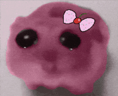 a pink piggy bank with a bow on it