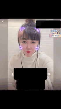 a picture of a woman with purple ears and a bun