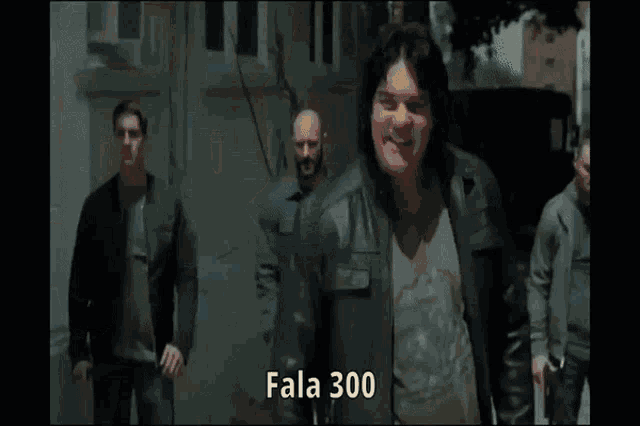 a man is holding a gun in a blurry photo and says fala 300