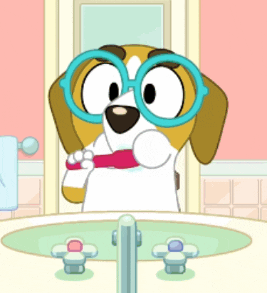 a cartoon dog wearing glasses is brushing his teeth in a bathroom sink .
