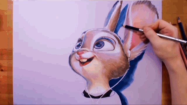a person is drawing a cartoon bunny with headphones on