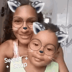 a woman and a child wearing glasses with cat ears on their faces