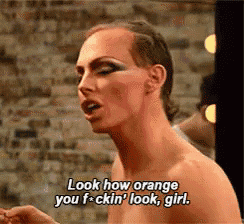 a shirtless drag queen is saying look how orange you f-ckin ' look girl