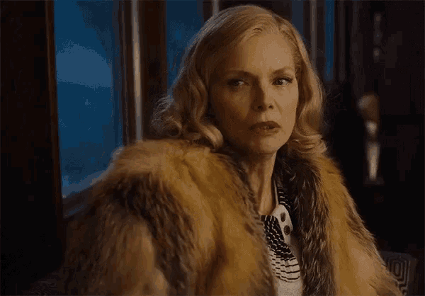 a woman in a fur coat with the words one of you people below her