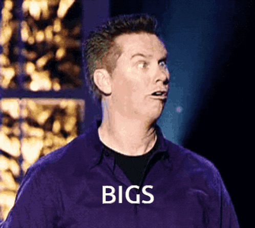 a man in a purple shirt with the word bigs on his chest