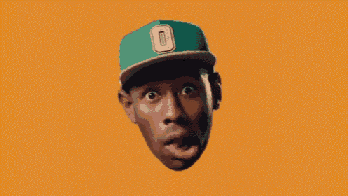 a man wearing a green hat with the letter o on the front