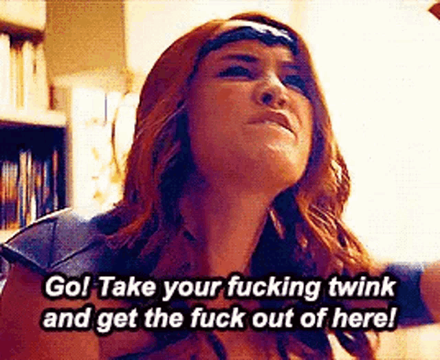 a woman in a superhero costume is yelling at someone .