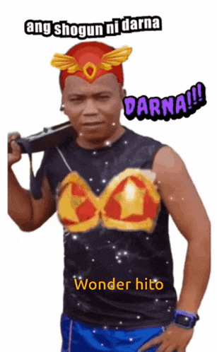 a man holding a gun and wearing a shirt that says wonder bito