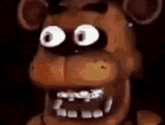a close up of freddy fazbear from five nights at freddy 's with big eyes and braces on his teeth .