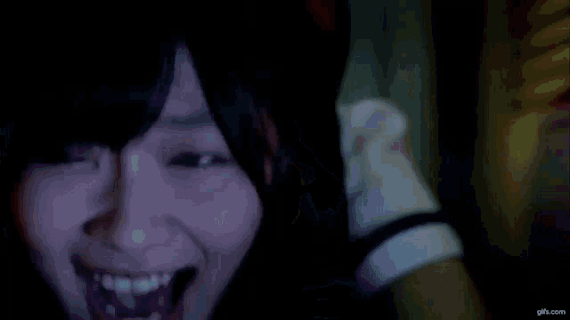 a person 's hand is sticking out of a doorway .