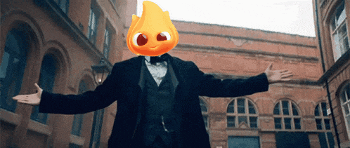 a man in a suit and bow tie has a cartoon character on his head