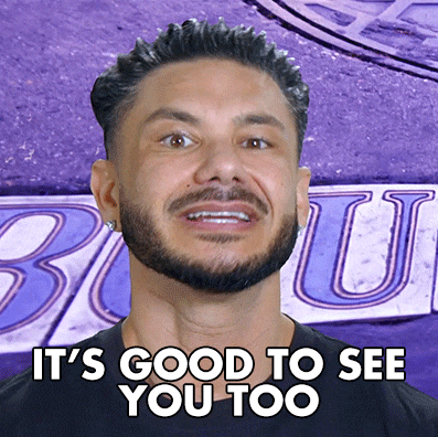 a man with a beard is smiling with the words it 's good to see you too below him