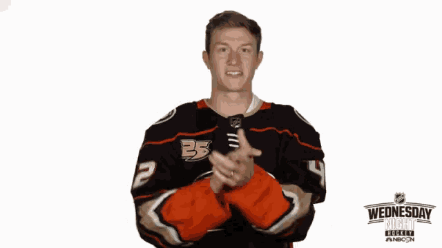 a man wearing a hockey jersey with the number 35 on it