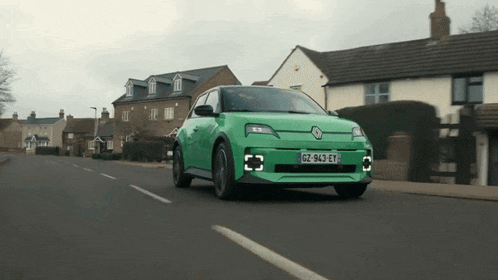 a green car with license plate gz-943-ex